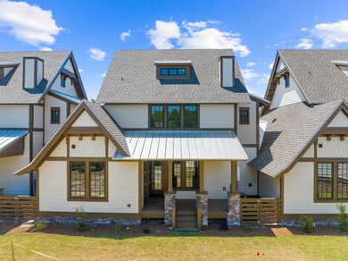 Discover the epitome of upscale living at the Townhomes at the - photo 3