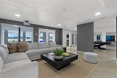 Experience luxury living in this exquisite 3-story waterfront