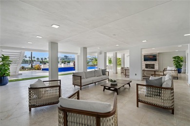 Experience luxury living in this exquisite 3-story waterfront
