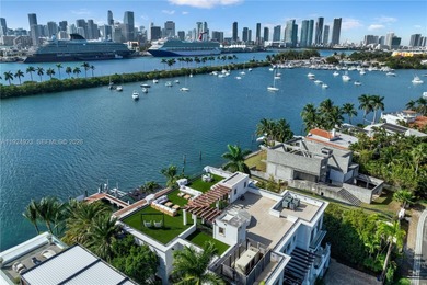 Experience luxury living in this exquisite 3-story waterfront