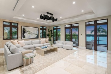 Experience luxury living in this exquisite 3-story waterfront