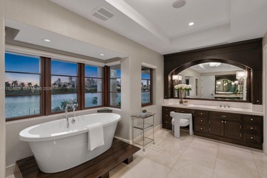 Experience luxury living in this exquisite 3-story waterfront