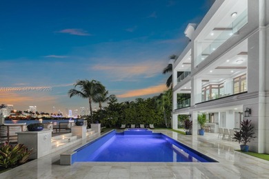 Experience luxury living in this exquisite 3-story waterfront