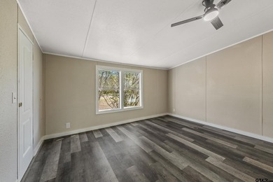 Welcome to this beautifully updated 4-bedroom, 2-bathroom mobile - photo 15