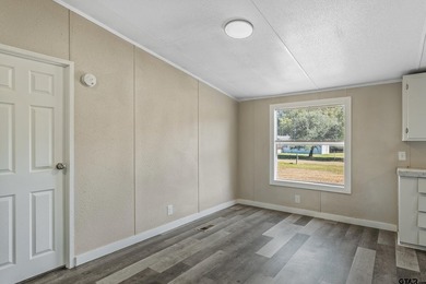 Welcome to this beautifully updated 4-bedroom, 2-bathroom mobile - photo 16