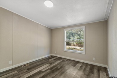 Welcome to this beautifully updated 4-bedroom, 2-bathroom mobile - photo 17