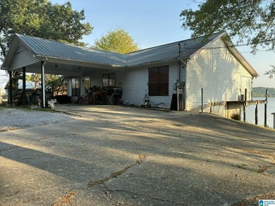 Welcome to 39 Sandy Hill Drive in Ohatchee, a waterfront - photo 1