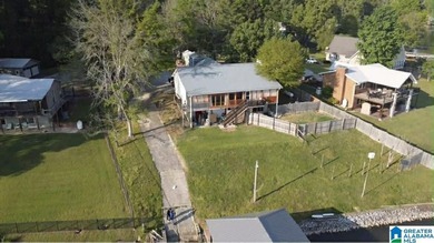 Welcome to 39 Sandy Hill Drive in Ohatchee, a waterfront - photo 2