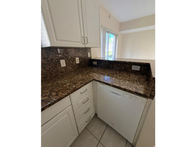 Welcome to this exceptional condominium located in the Cove at - photo 2