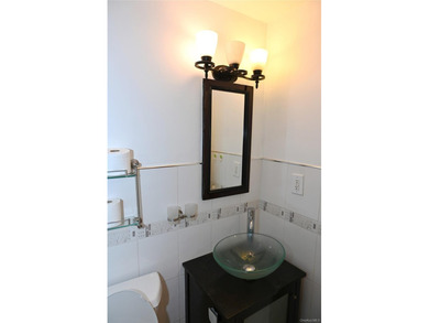 Welcome to Baybridge Condominiums, a prestigious 24-hour gated - photo 11