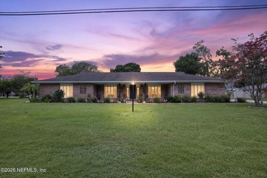Welcome to 8620 San Servera Drive W, a beautifully updated - photo 1