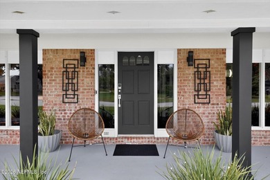 Welcome to 8620 San Servera Drive W, a beautifully updated - photo 5