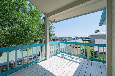 Canal front property with boat launch. This two-story, two-lot