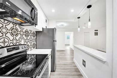 Modern coastal living East of US-1! This beautifully refreshed - photo 1