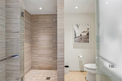 Experience elevated oceanfront living from this beautifully - photo 19