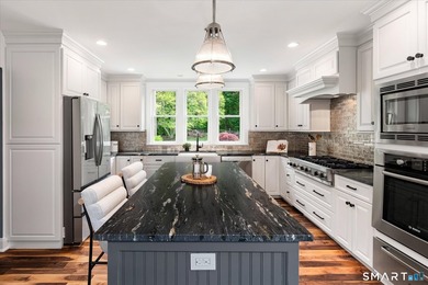 Beautifully updated 4/5 bedroom 4 1/2 bath residence offering a - photo 11