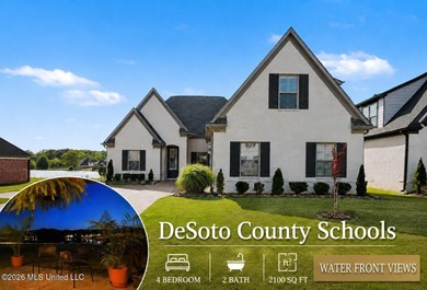 This Southaven showstopper offers beautiful water views right - photo 1