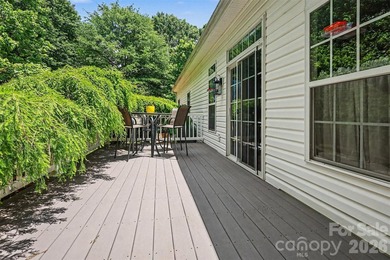 Stunning custom home on 5 private acres with a picturesque pond - photo 24