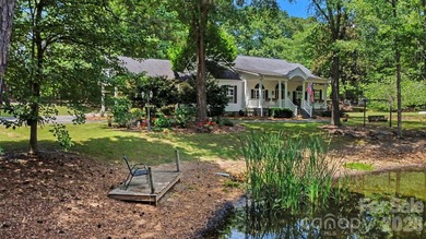 Stunning custom home on 5 private acres with a picturesque pond - photo 28