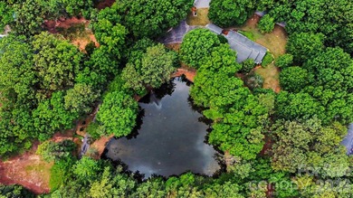 Stunning custom home on 5 private acres with a picturesque pond - photo 39