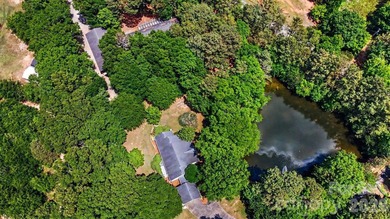 Stunning custom home on 5 private acres with a picturesque pond - photo 40