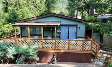 Tucked into a peaceful, wooded setting, this restored 2-bedroom - photo 1