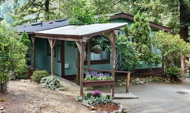 Tucked into a peaceful, wooded setting, this restored 2-bedroom - photo 2