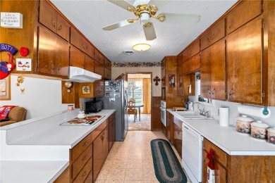 This home features a double lot and an oversized garage so you