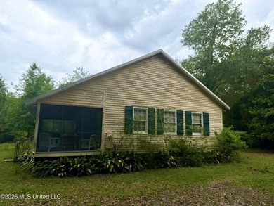 Tucked beneath a canopy of mature trees in the heart of Waveland - photo 2
