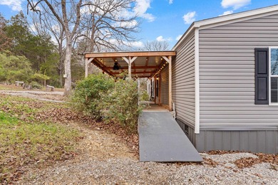 Tucked away at the end of the road on a private 1-acre lot, this