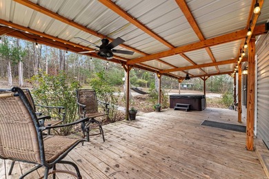 Tucked away at the end of the road on a private 1-acre lot, this