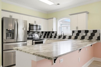 Welcome to this updated 3-bedroom, 2-bath end-unit condo in The - photo 14