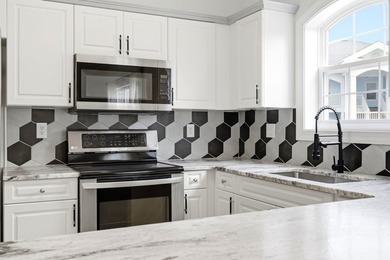 Welcome to this updated 3-bedroom, 2-bath end-unit condo in The - photo 23