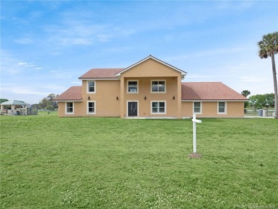 Welcome to this stunning waterfront home located on a rim canal - photo 3