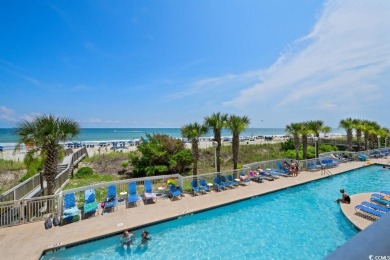 Step right onto the sand from this desirable first-floor, direct