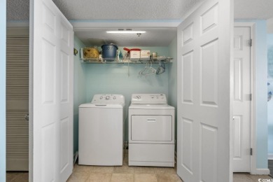 Step right onto the sand from this desirable first-floor, direct