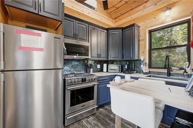 Secluded on 22.27 acres along the Kings River, this - photo 3