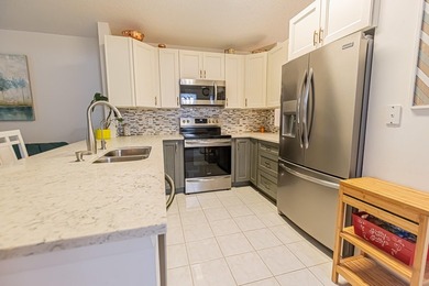 Welcome to this beautifully updated corner villa in the - photo 6