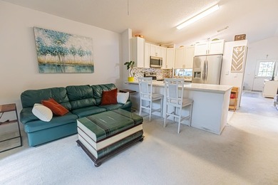 Welcome to this beautifully updated corner villa in the - photo 7