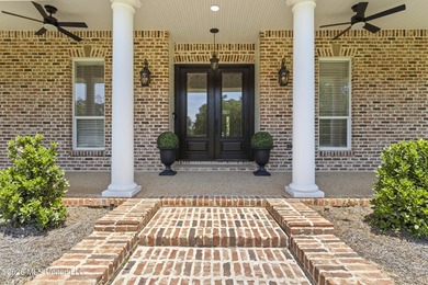 Tucked behind a gated entrance on 5 private acres, this - photo 9