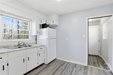 This charming home shines with new carpet, new LVP flooring, and - photo 9