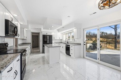 Beautifully updated Spanish style tri-level with an unfinished - photo 16