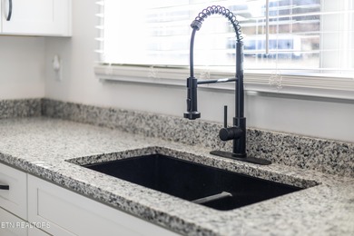 Beautifully updated Spanish style tri-level with an unfinished - photo 18