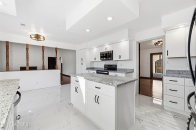 Beautifully updated Spanish style tri-level with an unfinished - photo 19