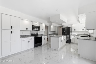 Beautifully updated Spanish style tri-level with an unfinished - photo 20