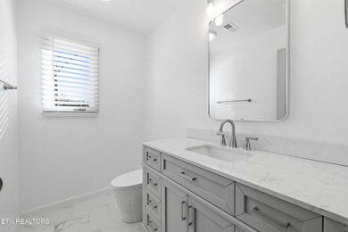Beautifully updated Spanish style tri-level with an unfinished - photo 26