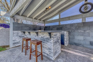 The backyard alone will sell this house. A custom covered - photo 9