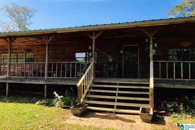 This 5.25-acre mini-farm features a durable metal roof, redwood - photo 3