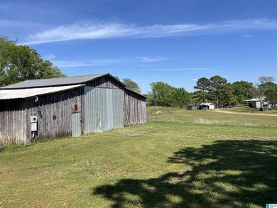 This 5.25-acre mini-farm features a durable metal roof, redwood - photo 5