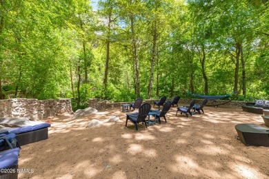 Set beneath the canopy of mature pines and just steps from the - photo 32